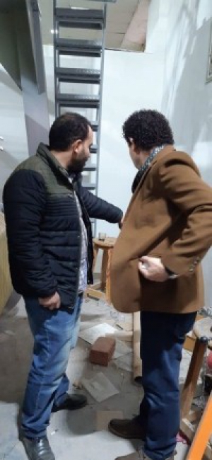 The faculty’s dean inspects the textile workshop