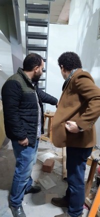 The faculty’s dean inspects the textile workshop